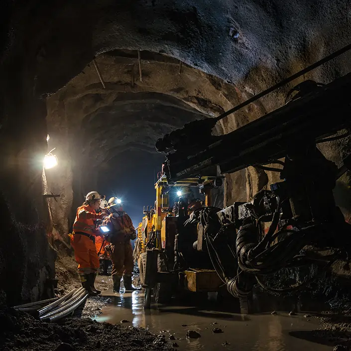 miners wearing ppe in an underground mine